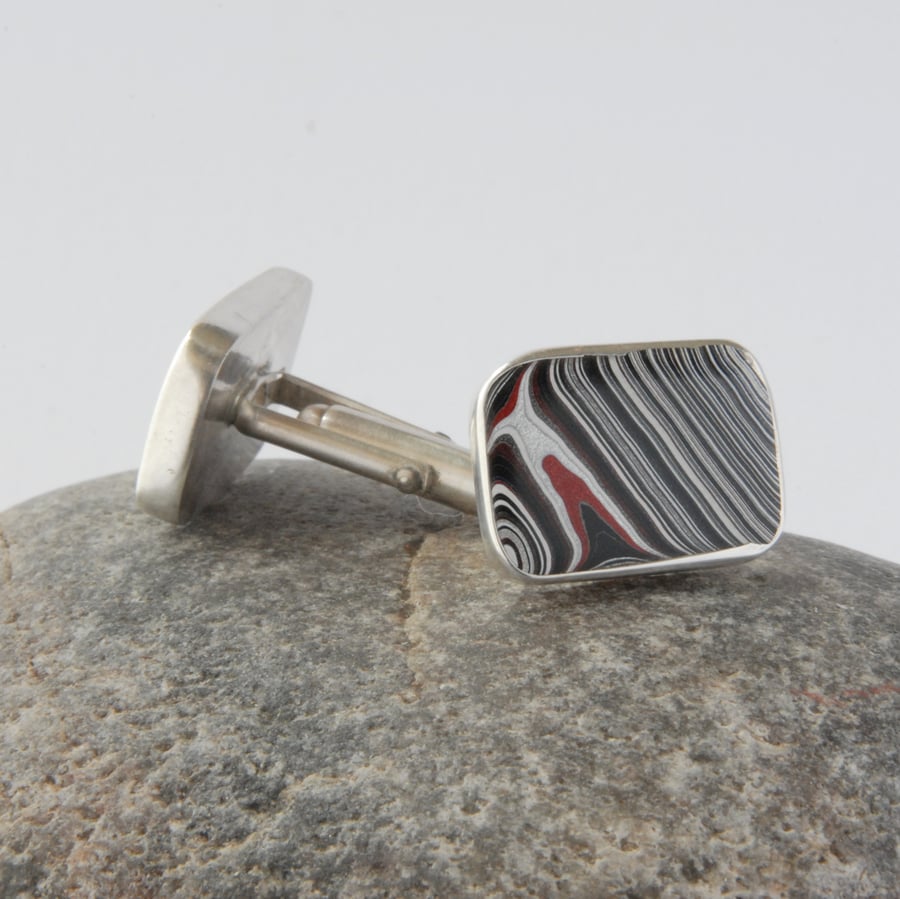 Sterling silver and early 00's fordite swivel back cufflinks