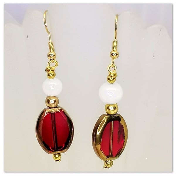 Red Glass beads earrings with white beads on gold plated hooks.