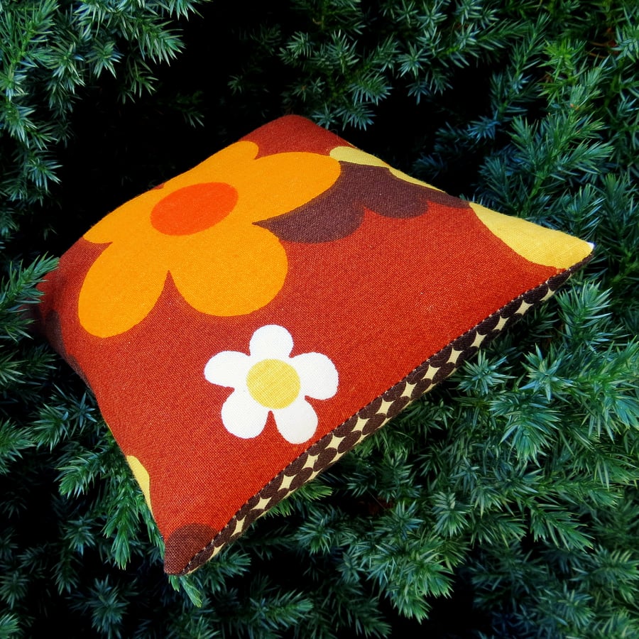A pin cushion made from an iconic vintage fabric. 1960s flower power.
