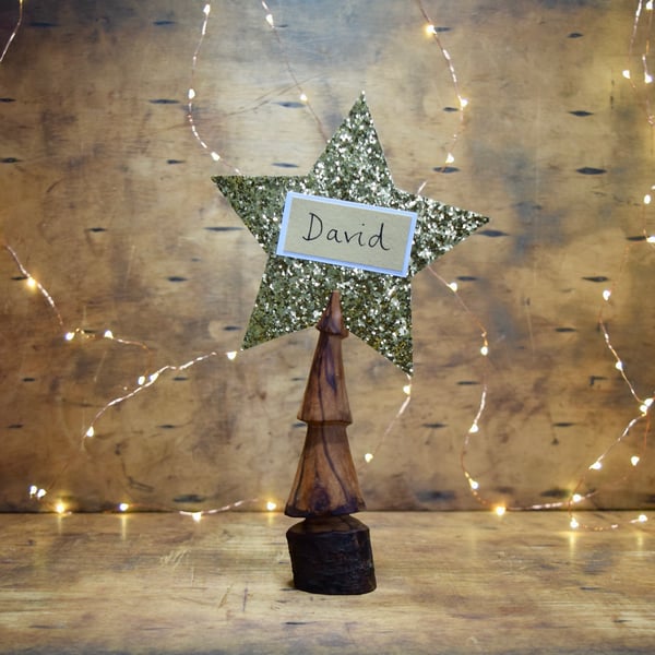 Hand carved wooden Christmas tree decoration to hold Christmas card