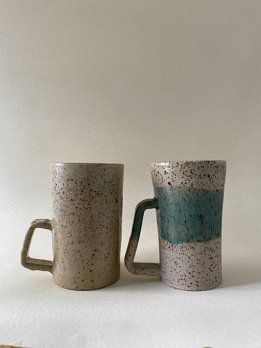 Tall handmade ceramic cups.