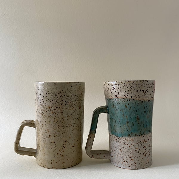 Tall handmade ceramic cups.