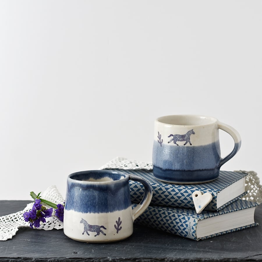 Handmade blue and white espresso cup with horse - illustrated stoneware pottery