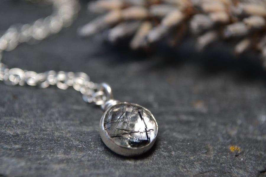 Tourmalinated quartz pendant