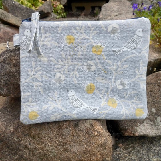 Make up bag in grey and yellow bird print fabric with zip