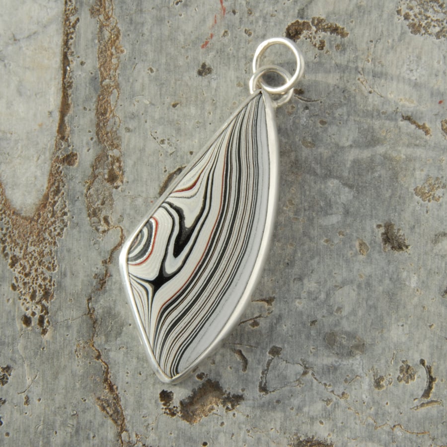 Black and white fordite with sterling silver pendant