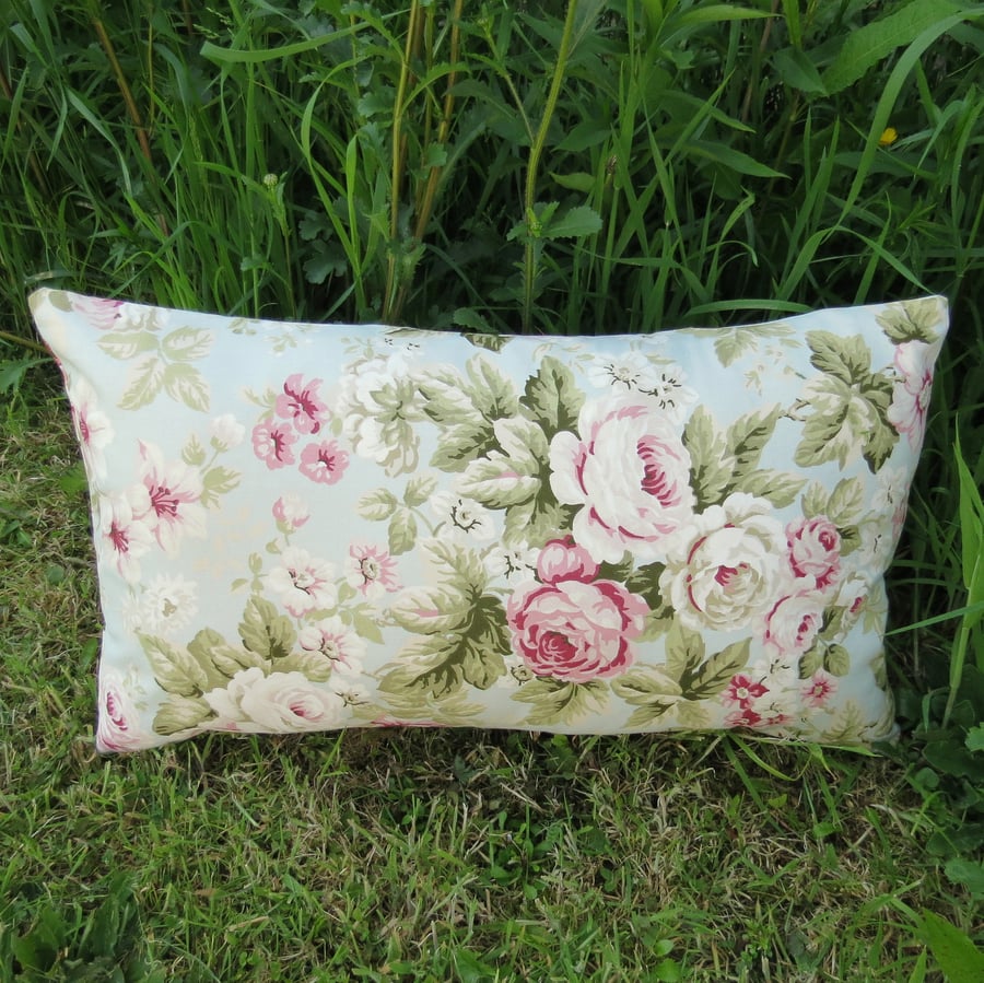Blowsy roses.  A floral cushion, complete with cushion pad.