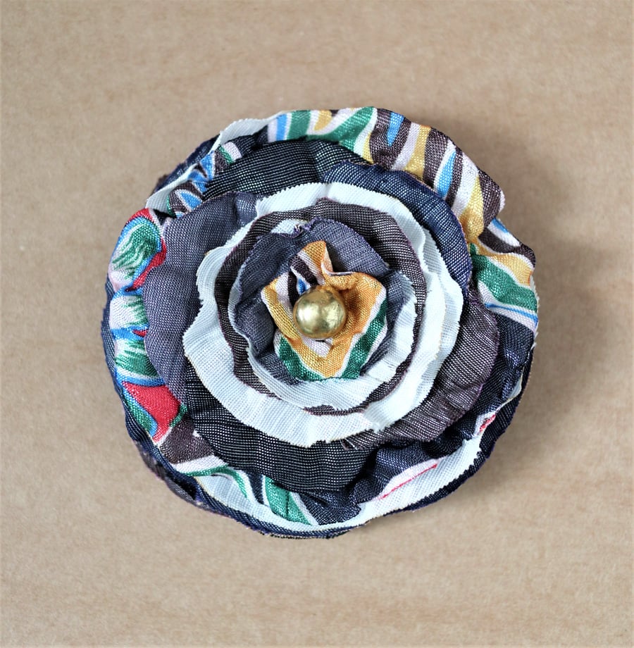 Up-cycled charcoal grey and graphic pattern textile floral design brooch