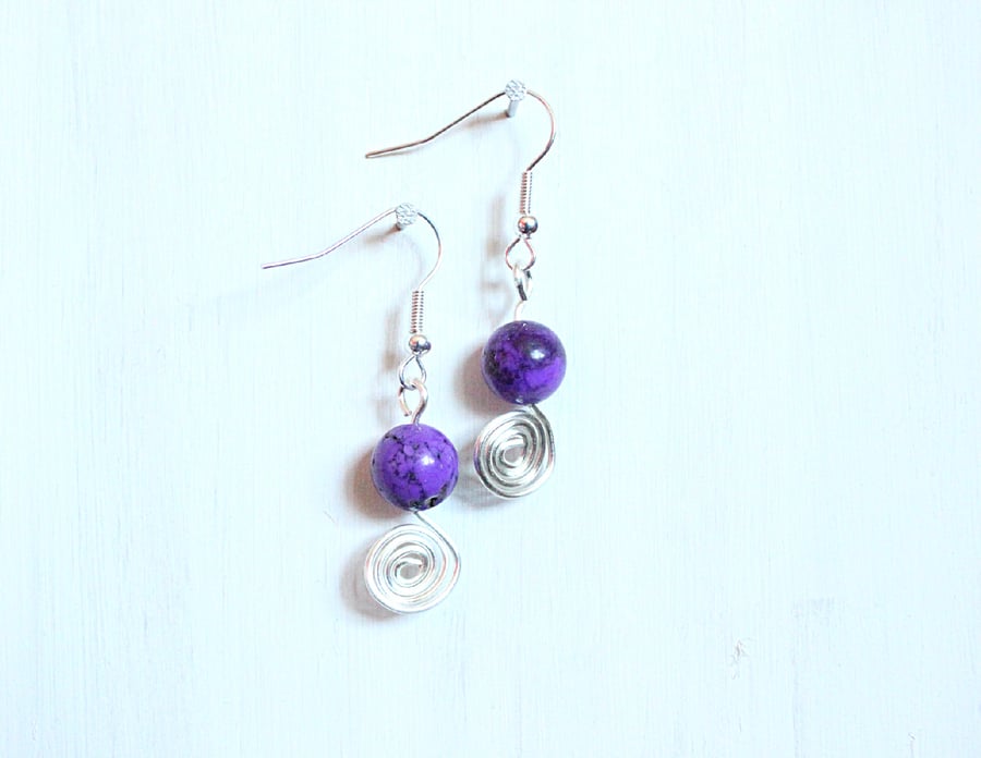 Purple dyed howlite and silver spiral dangle earrings