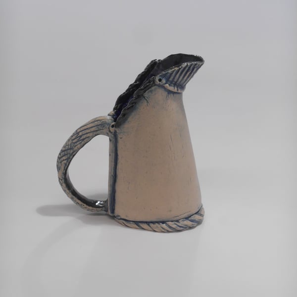 Jug Horse shoe based ceramic.