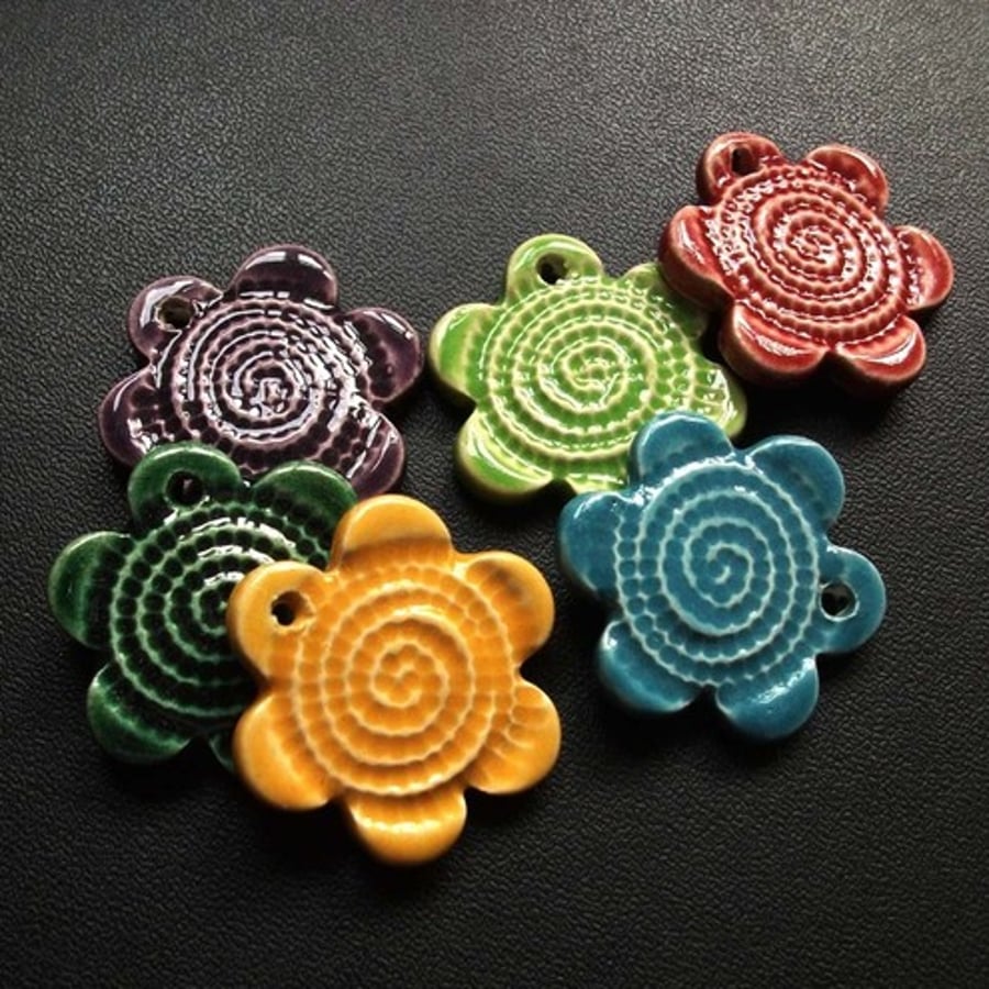 Set of six multicoloured ceramic charms