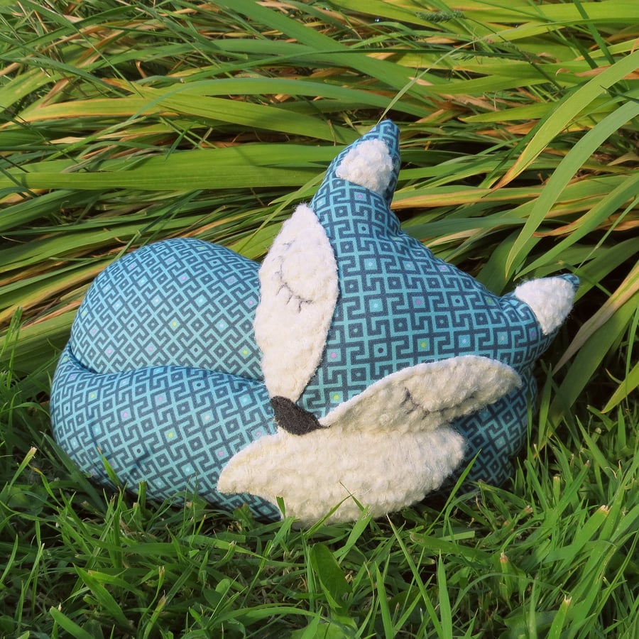 A snoozy fox doorstop.  29cm in length.  11.5 inches.