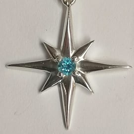 Star pendant hand made from Sterling Silver set with a Blue Topaz stone