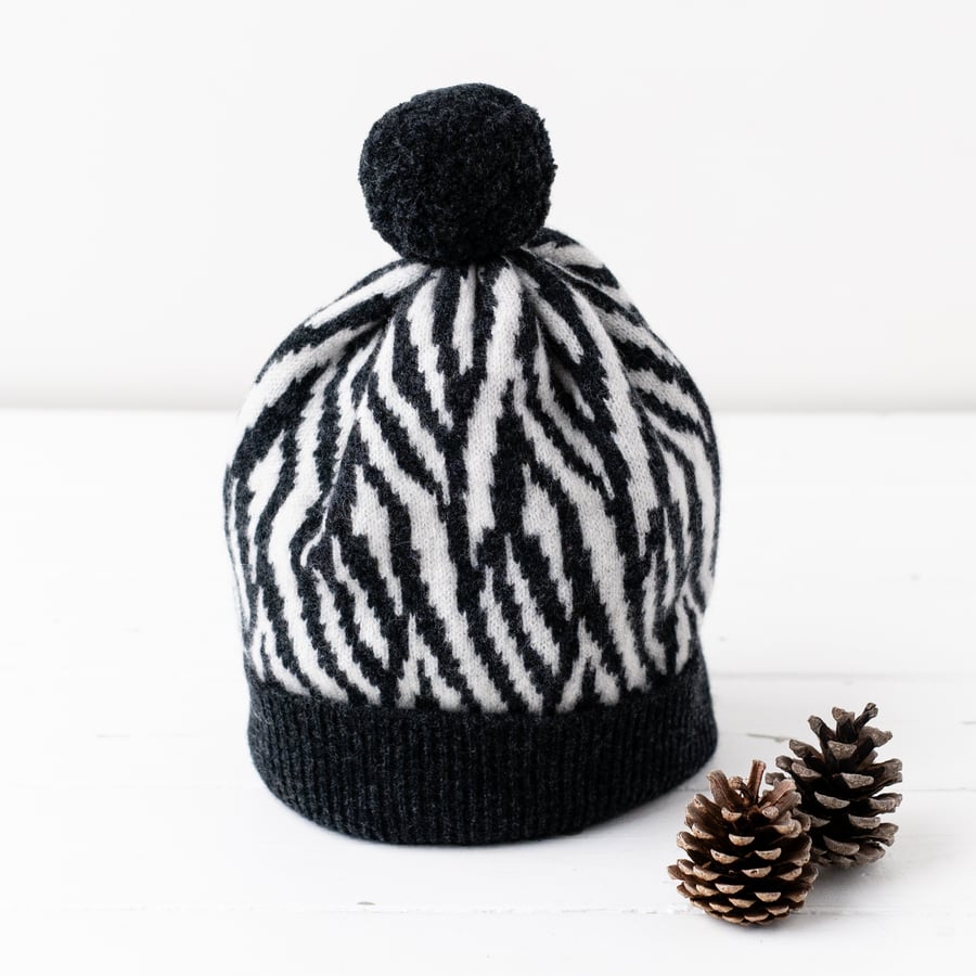 Zebra knitted pom pom hat