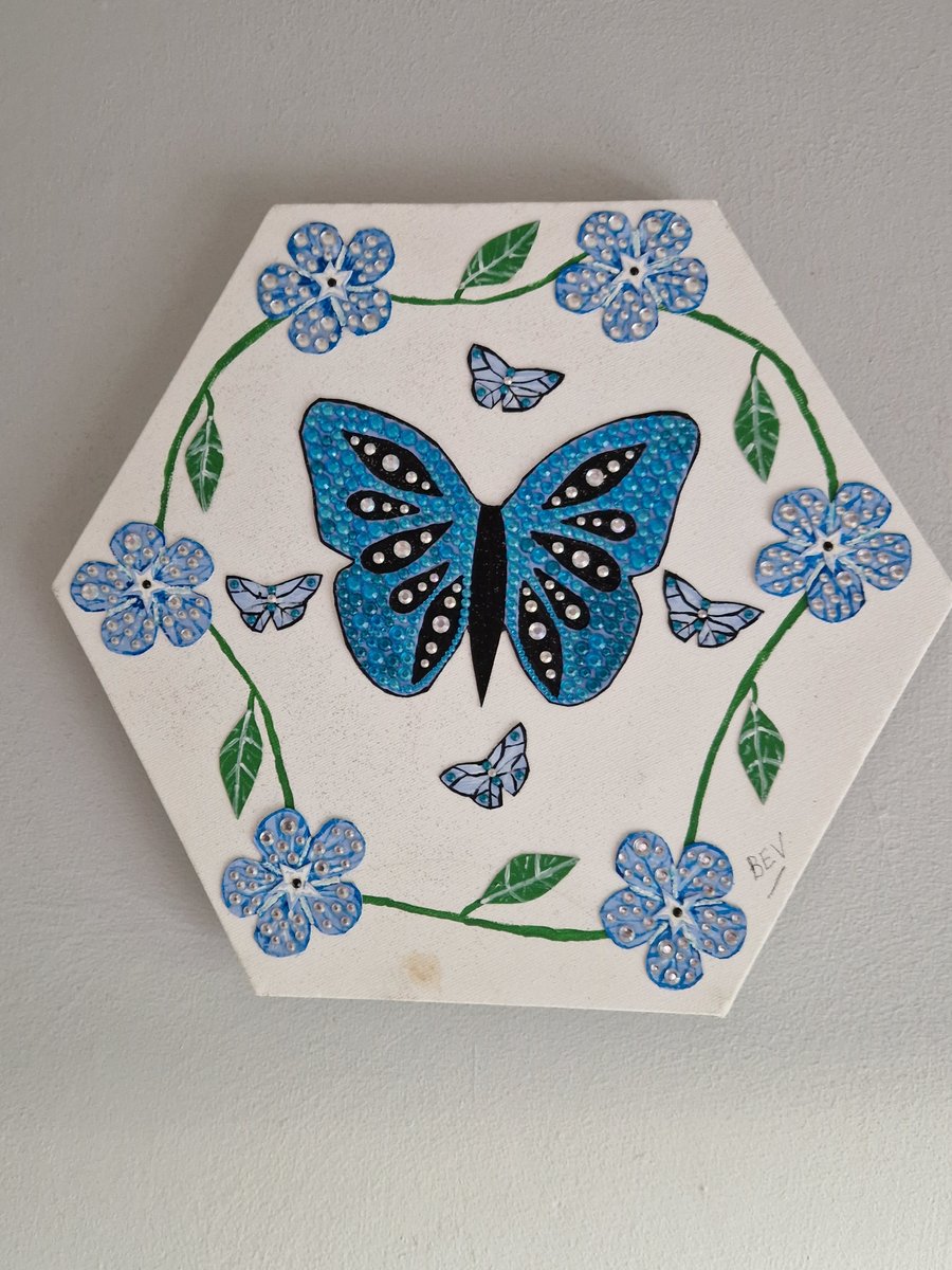 Blue butterfly and flowers. 