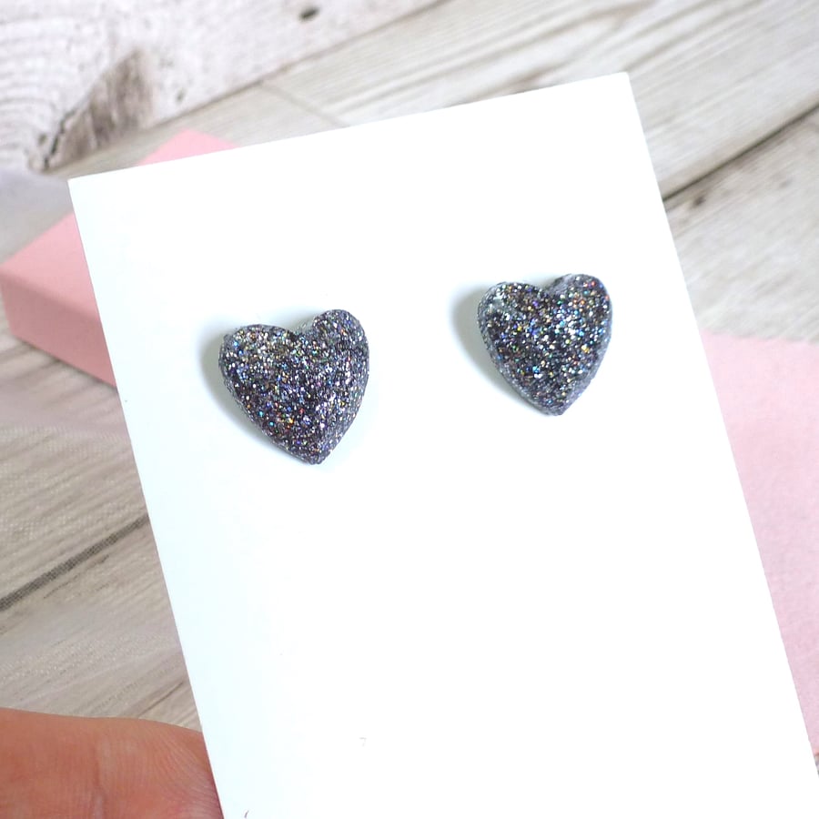 Holographic silver heart stud earrings. Sparkly silver glitter heart studs