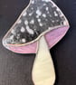 Stained glass mushroom - spotted white cap with wispy pink gills