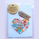 'Hugs' hanging heart decoration with plantable wildflower seed card