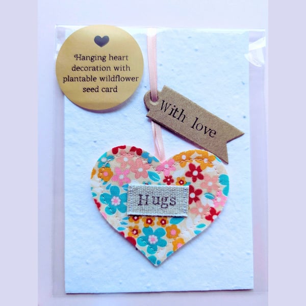 'Hugs' hanging heart decoration with plantable wildflower seed card