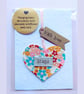'Hugs' hanging heart decoration with plantable wildflower seed card