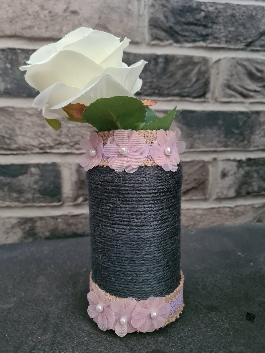Dark grey yarn wrapped vase with pink flowers