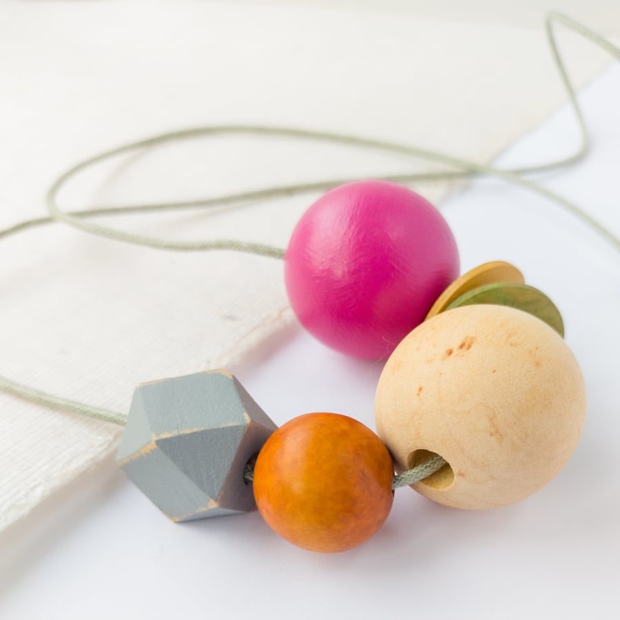 Isla - Hot pink, olive green, burnt orange necklace with grey hexagonal bead