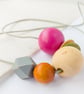 Isla - Hot pink, olive green, burnt orange necklace with grey hexagonal bead - Image 1