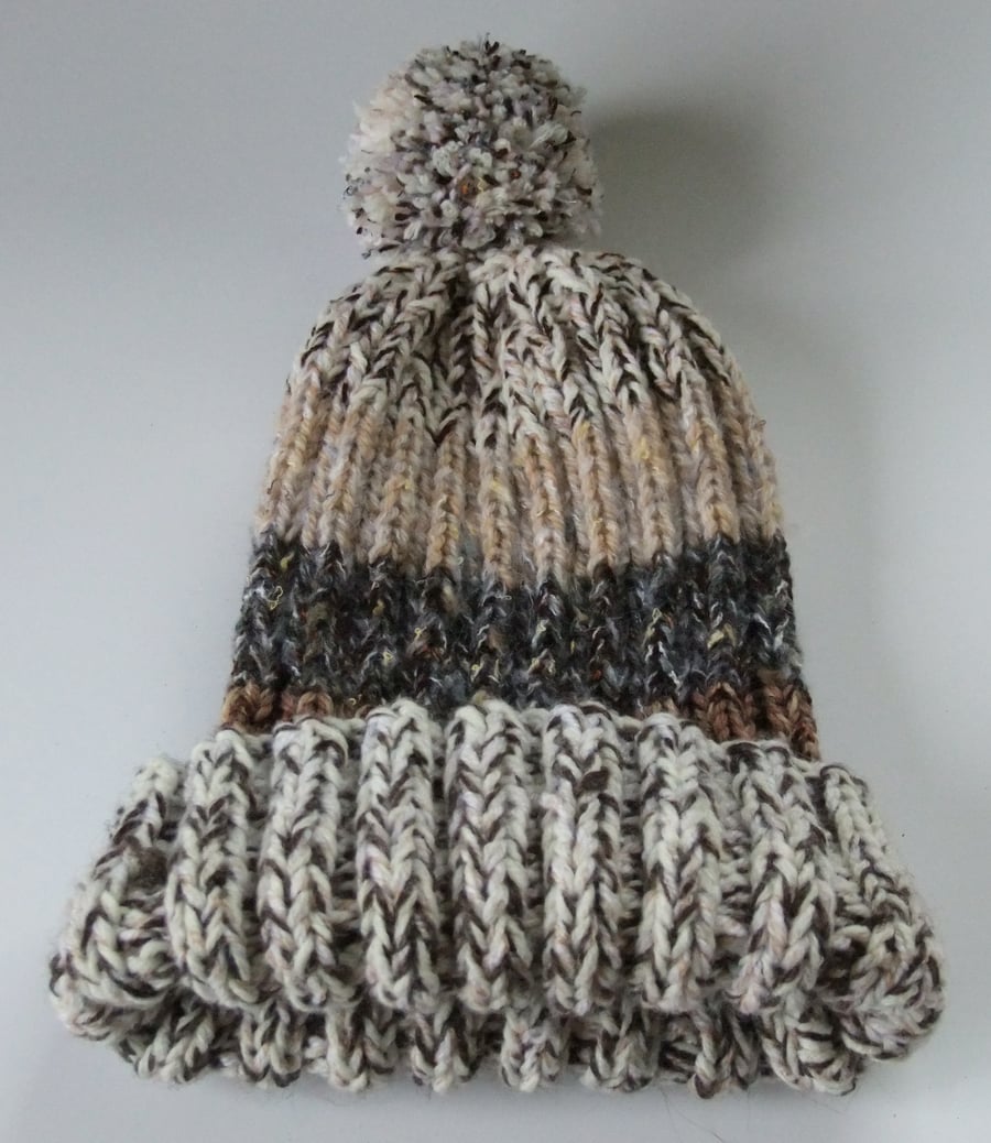 Shades of brown knitted bobble hat hand made from warm soft chunky wool.