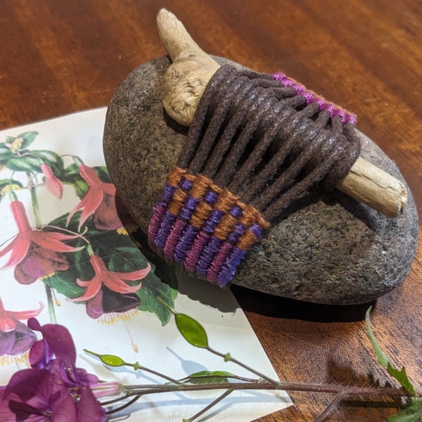 Wrapped rock and driftwood: Embellished with woven panel