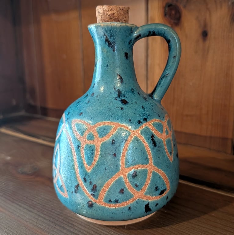 Turquoise triquetra potion bottle
