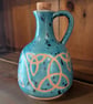 Turquoise triquetra potion bottle
