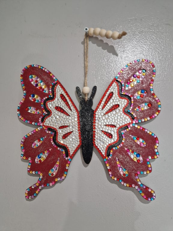 Large wooden red and multi coloured butterfly. 