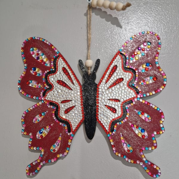 Large wooden red and multi coloured butterfly. 