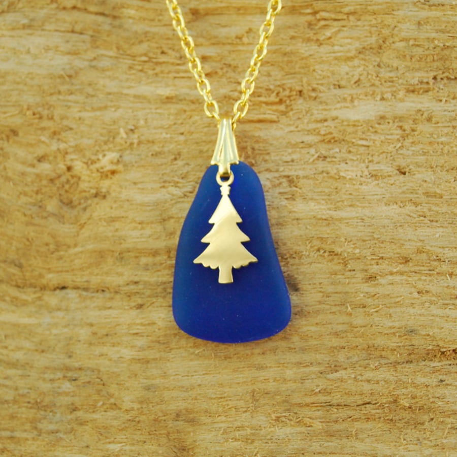Blue beach glass pendant with Christmas tree charm
