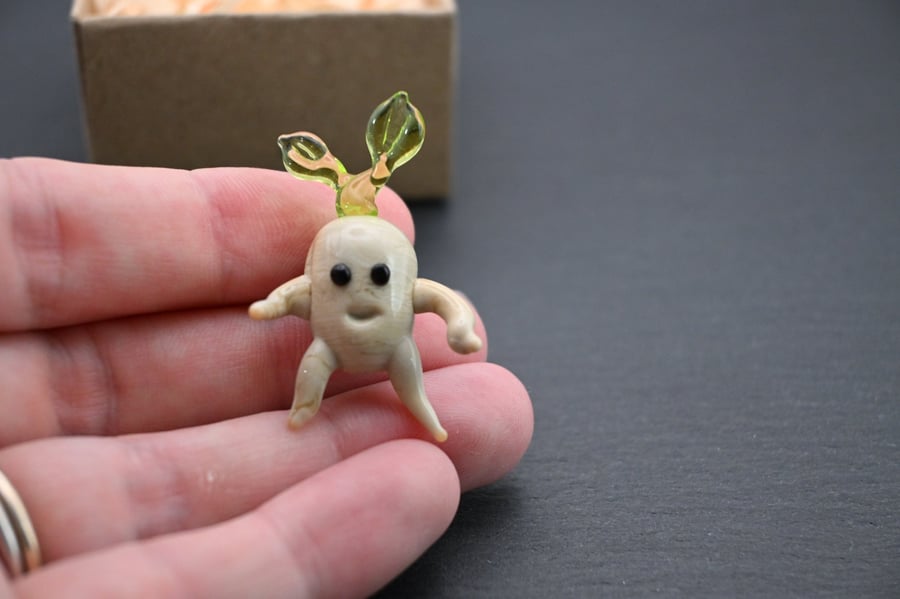 small glass mandrake figure