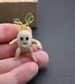 small glass mandrake figure