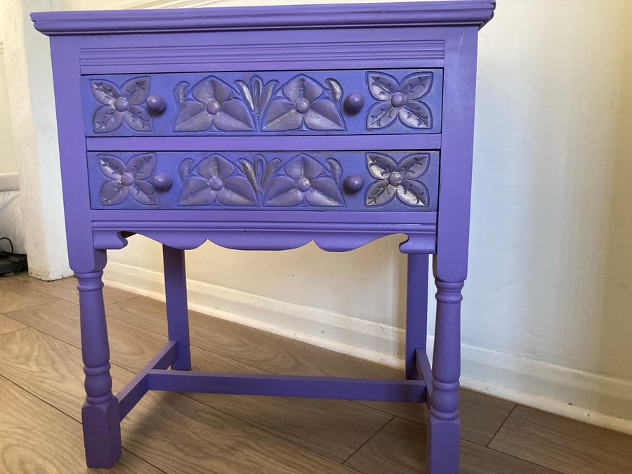 Small  set of drawers painted in lilac and lavender with gold highlights