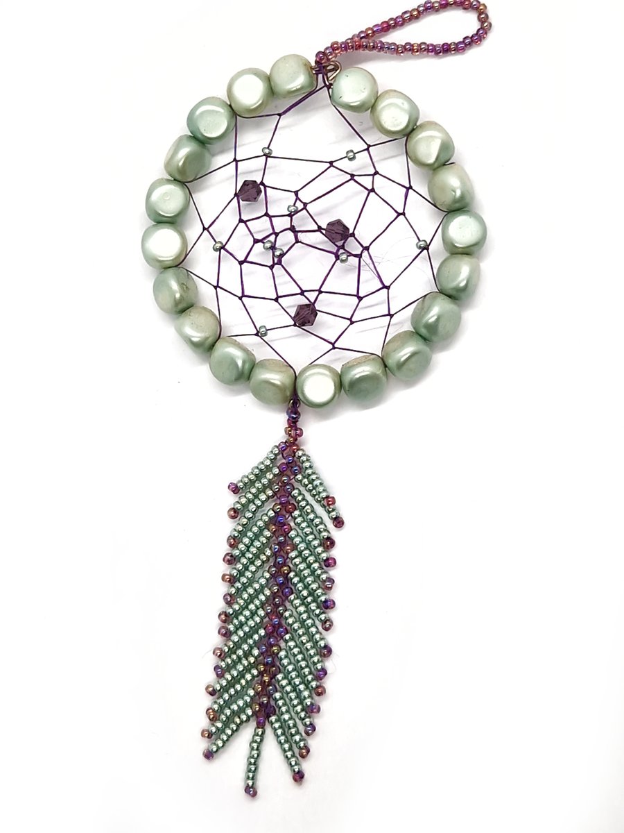 Small shimmering turquoise and purple beaded feather dream catcher