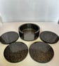 Black and silver set of 4 resin coasters and holder.