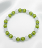 Olive and White Cats Eye Glass Stretch Bracelet. 