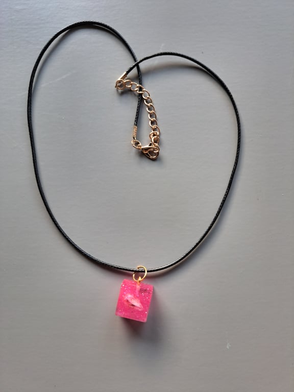 Pink Resin Pendant with Shell and Gold Accents on black Cord