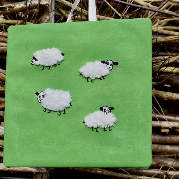 Happy sheep embroidered picture.