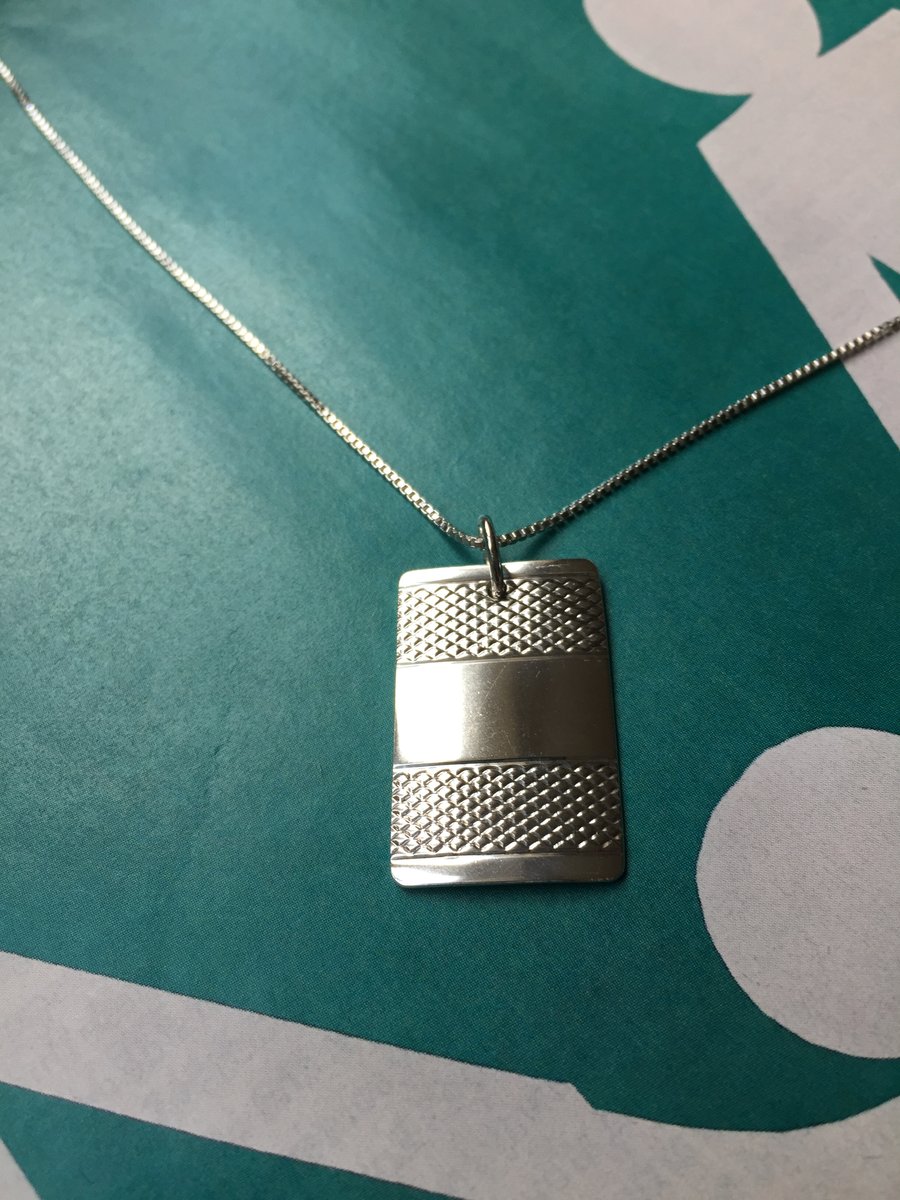 Oblong necklace made from a 1953 Sheffield silver napkin ring