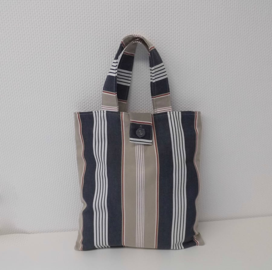 Striped tote bag with button fastening