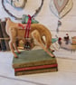 The tree deliverer handmade deer with tree soft sculpture textile art.