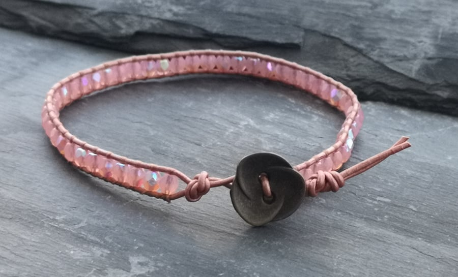 Rose gold and pink leather and glass bead bracelet with flower button