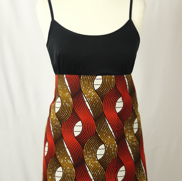 Purple and Gold Ankara Fabric with Eye Symbol and Geometric Lattice Design