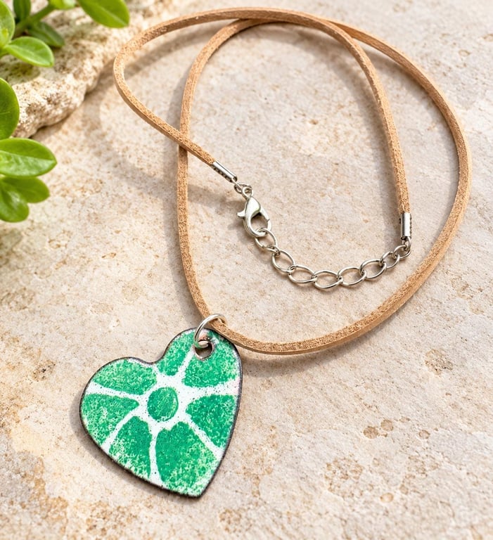 Green and white botanical enamel pendant, with leather and chain cord.