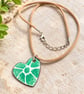 Green and white botanical enamel pendant, with leather and chain cord.