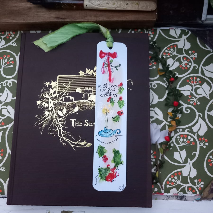 Hand drawn and painted book mark. In stillness we find our answers''